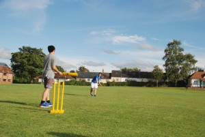 International Students Playing Cricket